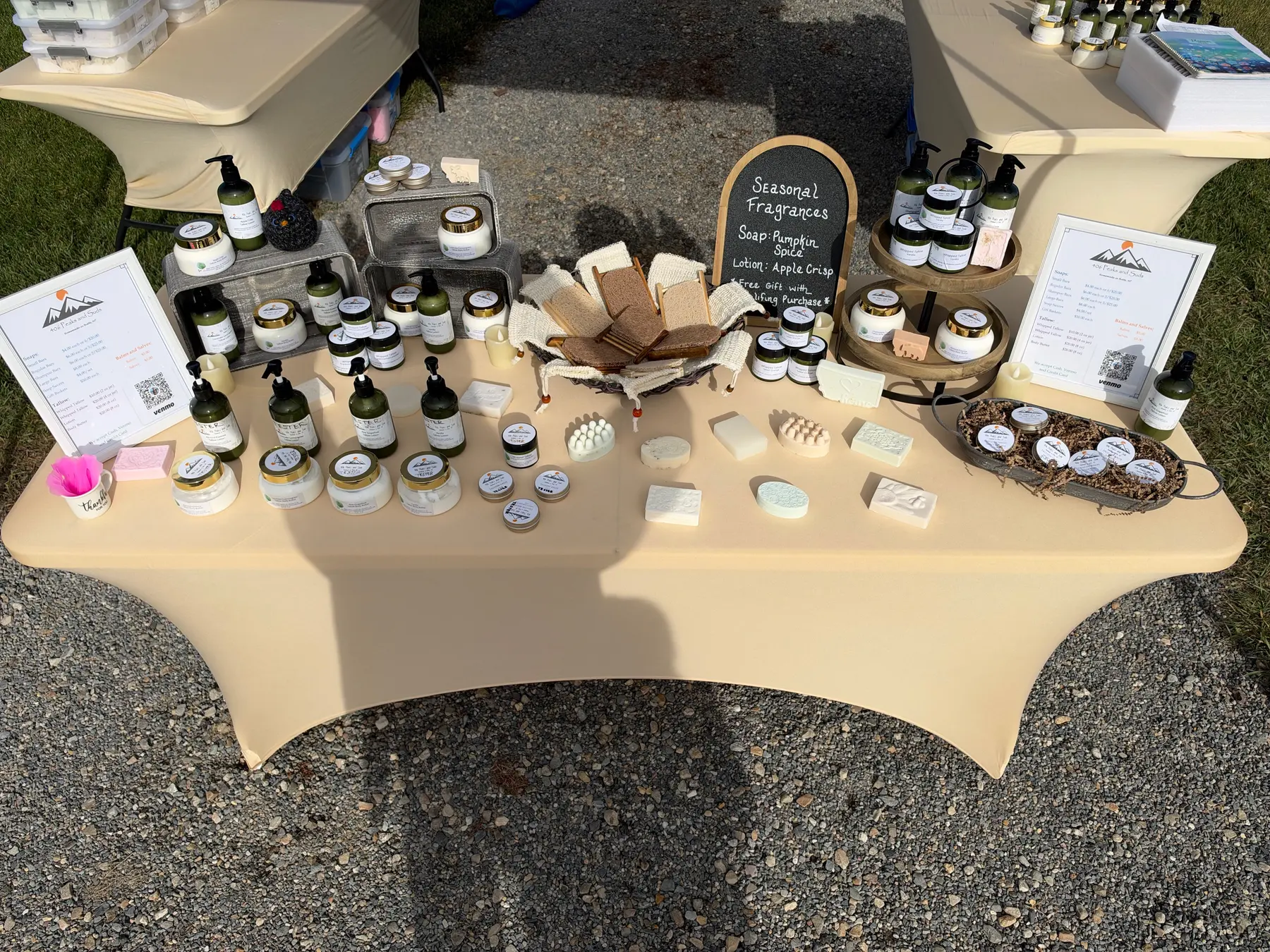 406 Peaks and Suds booth with handmade soaps and tallow skincare at a Montana market